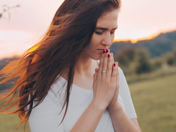 Woman praying and repenting