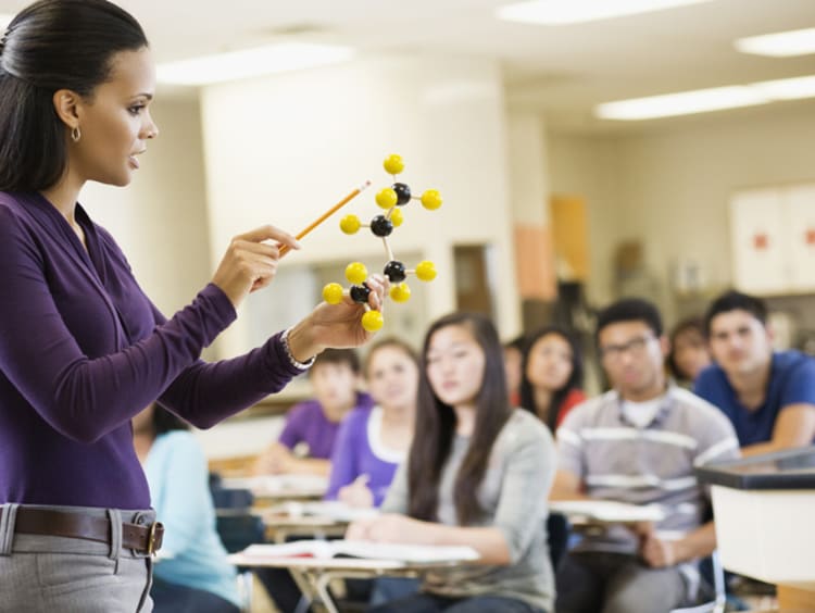 female teacher demonstrating to students