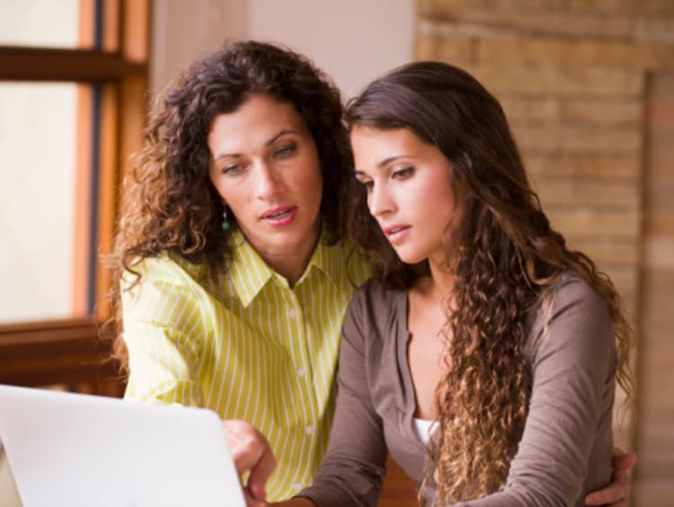 A mom helping her student study for standardize testing