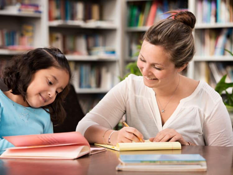 A reading specialist working one-on-one with a student