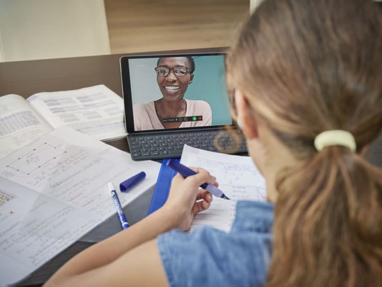 student engaging with teacher in virtual learning environment