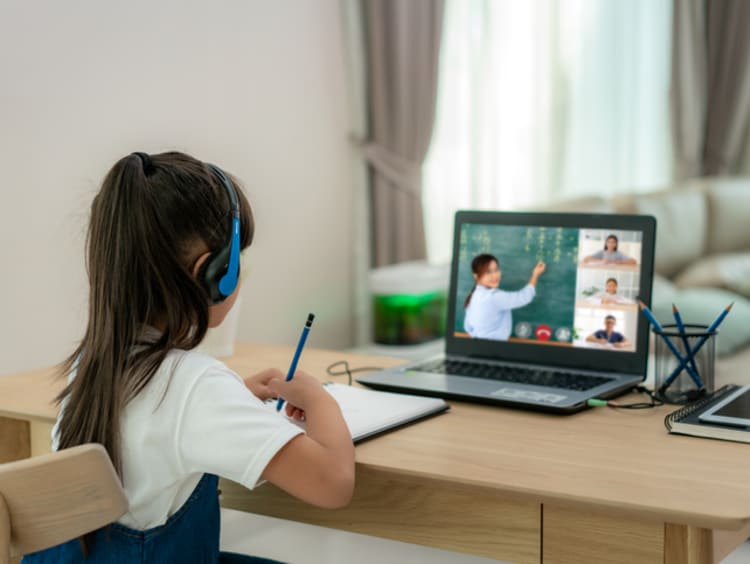 young student going to school from home using blended learning approach