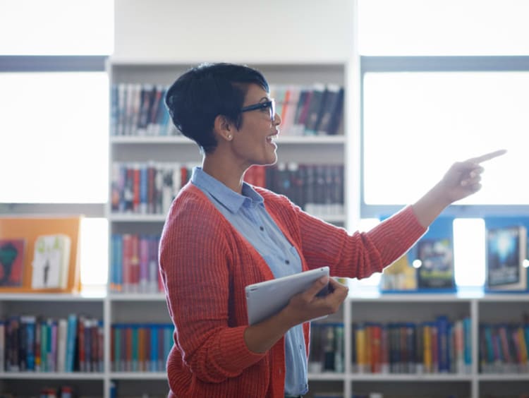 Female teacher instructing her students