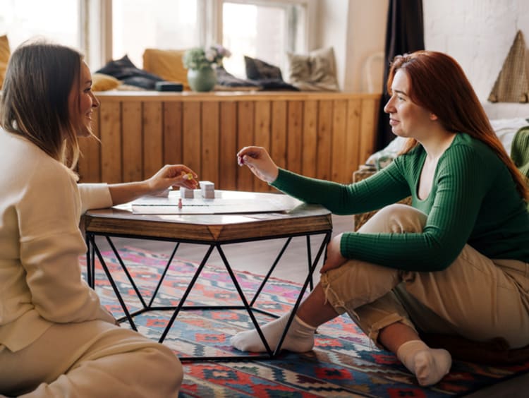 Female friends playing board games