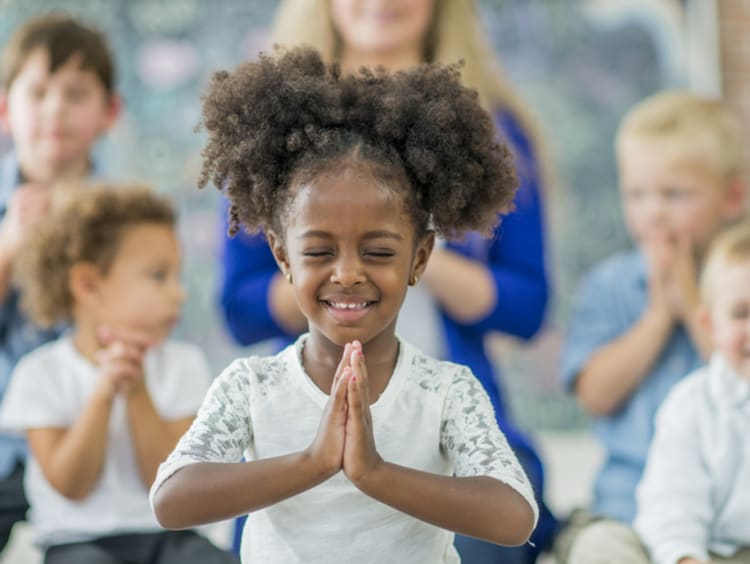 Kids praying at Sunday school 