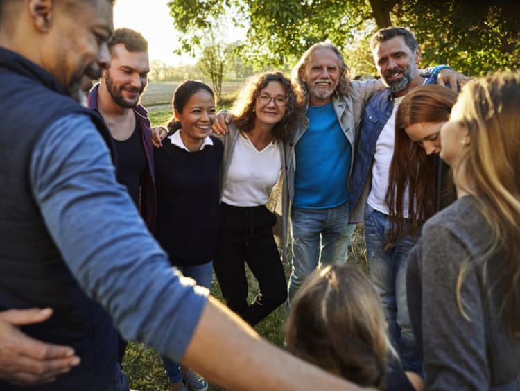 Group of believers linking arms and finding strength in numbers