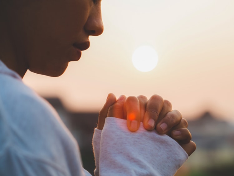 Woman praying in the morning