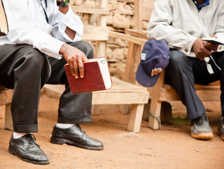 Missionaries sharing the word of God with each other