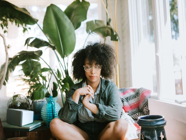 Woman praying intentionally to God 