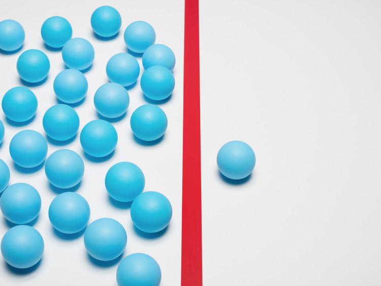 Ping pong balls divided across a line