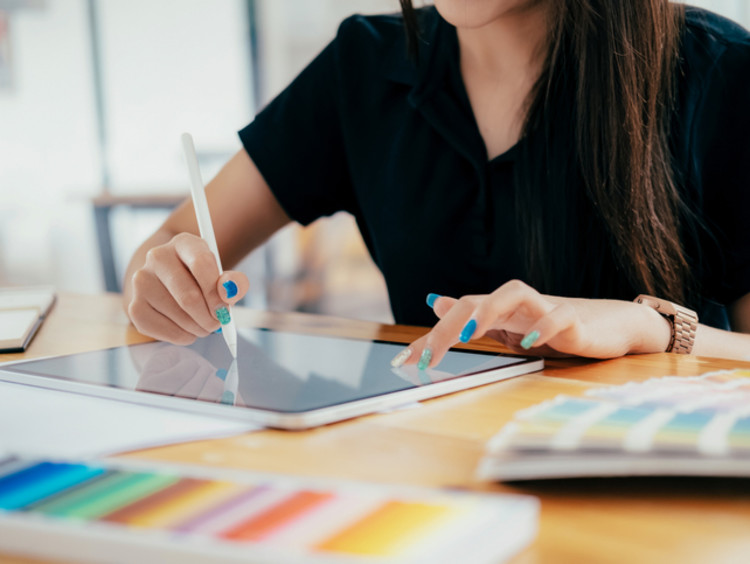 a graphic designer working in her office