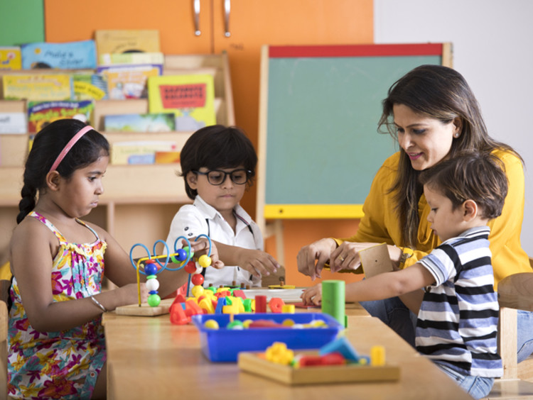 preschool teacher with children