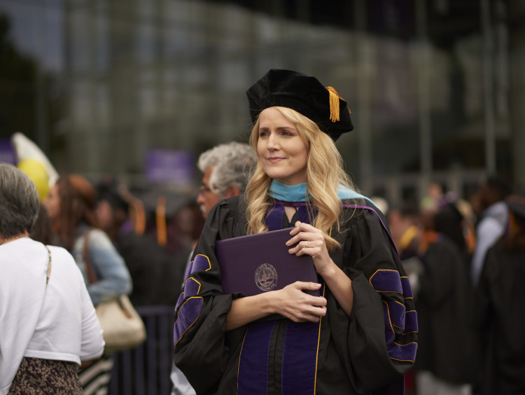 GCU student with her degree