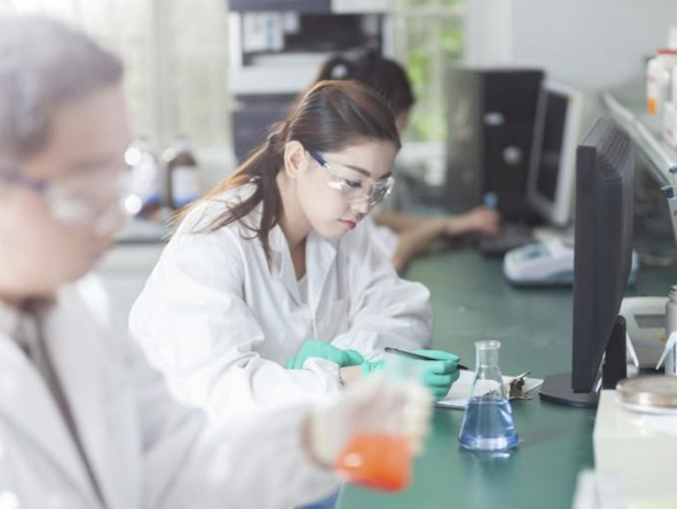 scientists experimenting in a lab
