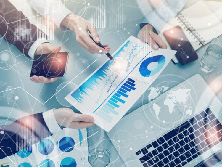 hands pointing to data sheet