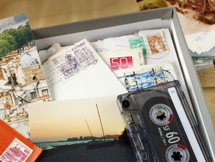 Box of postcards and cassette taps
