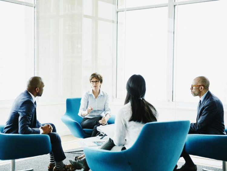People sitting in chairs talking