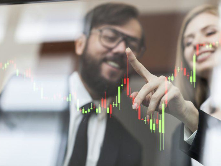 Man and woman view bar charts