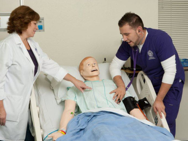 nursing student working with a doctor