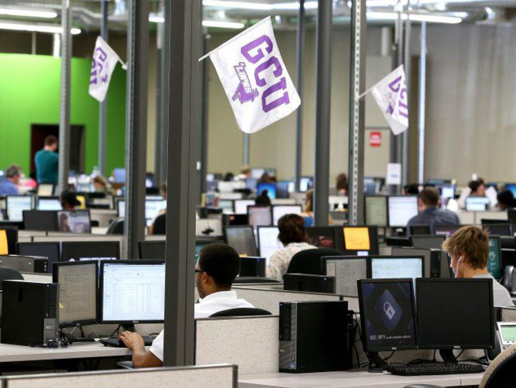 gcu employees on the computer