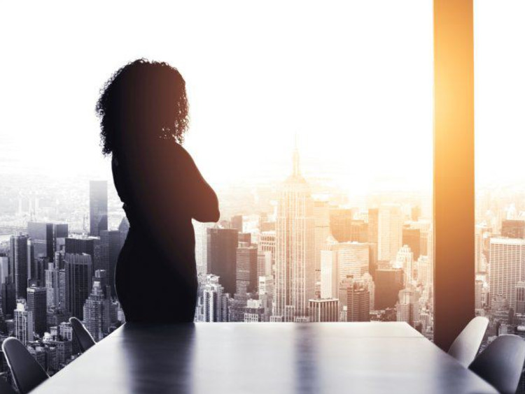 woman looking out a window