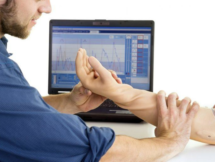 Man holding prosthetic arm