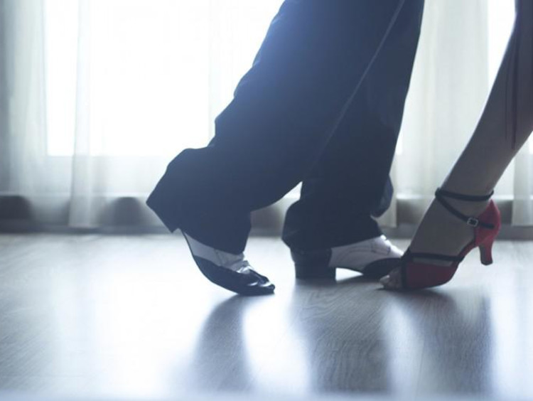 Foot view of two dancers about to do the Tango dance