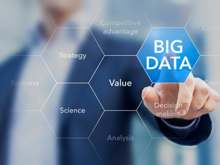 Businessman pushes a virtual big data button on glass screen