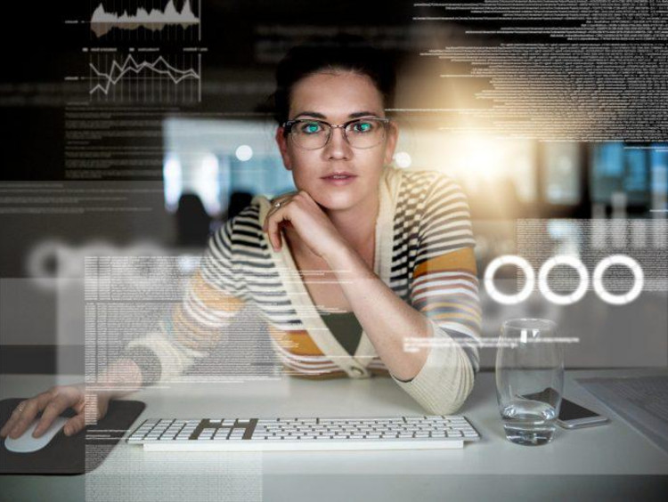 woman looking at numbers on a screen