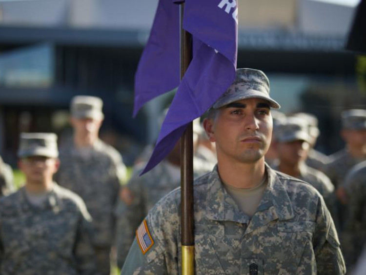 GCU veteran student holding a flag