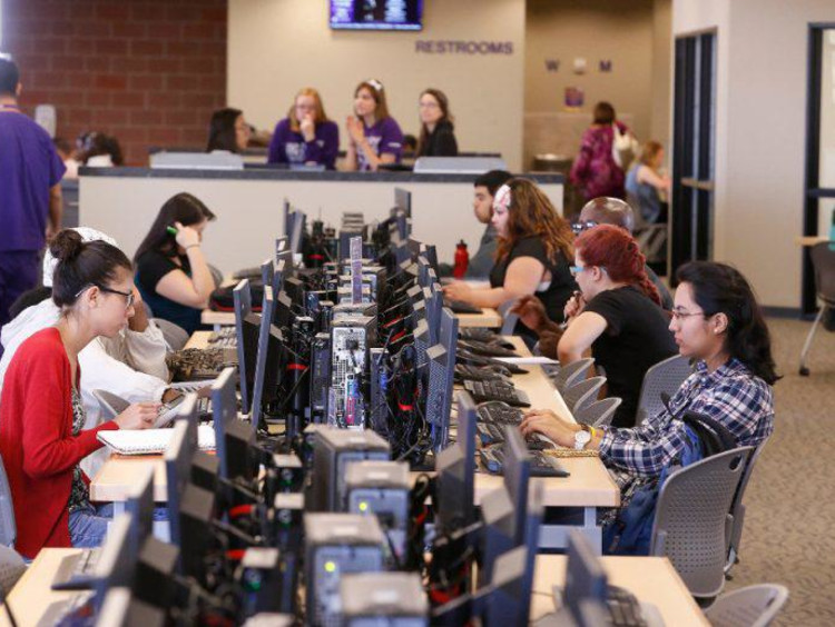 GCU students working at computers in the library