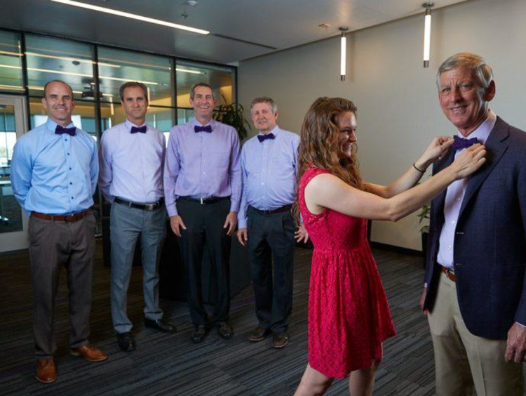 Brian Mueller and other members of the leadership team with Andrea Northup of bowtie business.
