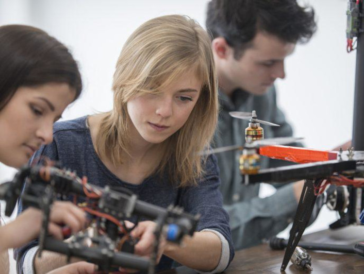 STEM students working in a robotics lab