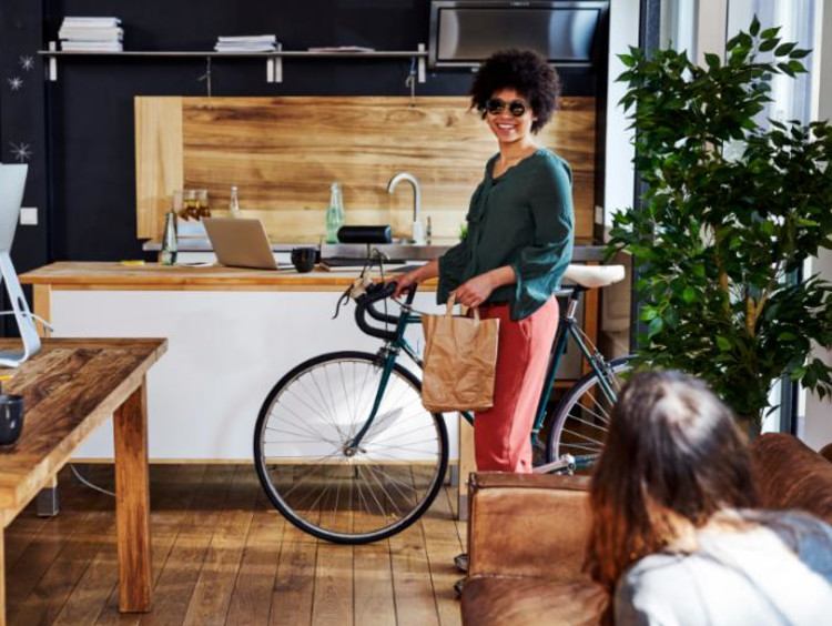 Woman riding a bicycle in an office