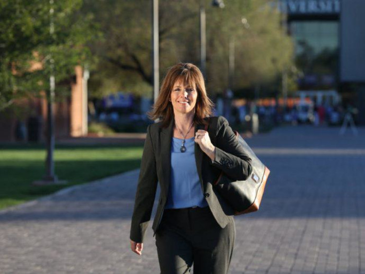 Doctoral Learner walks on campus