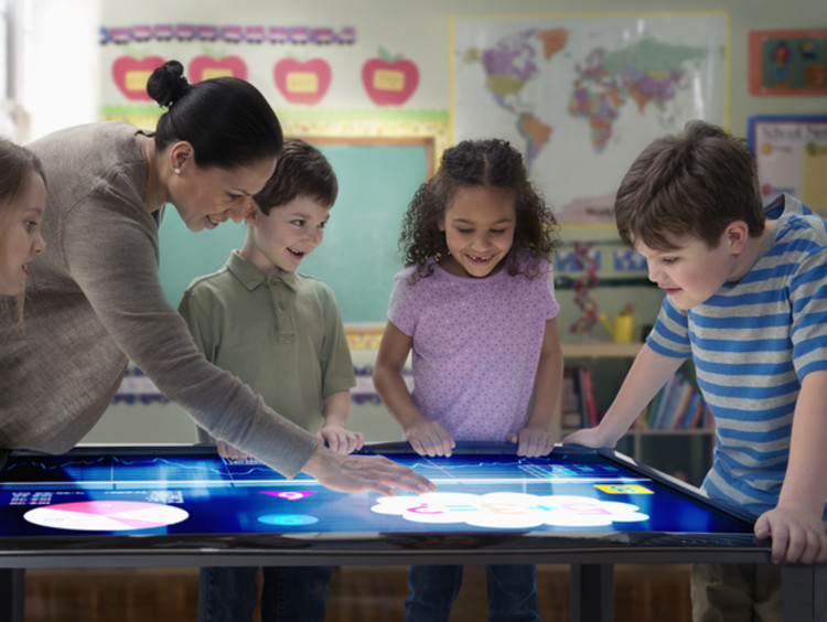 Diverse students interacting with an electronic map