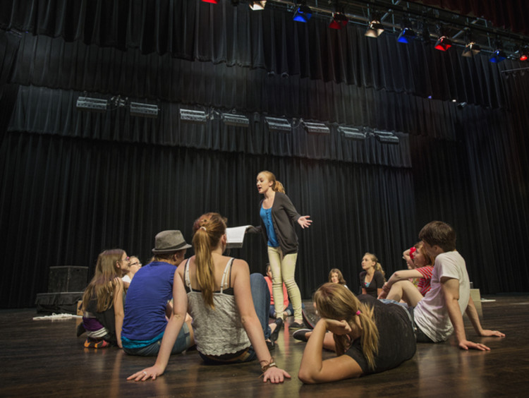 A group of actors rehearsing a play