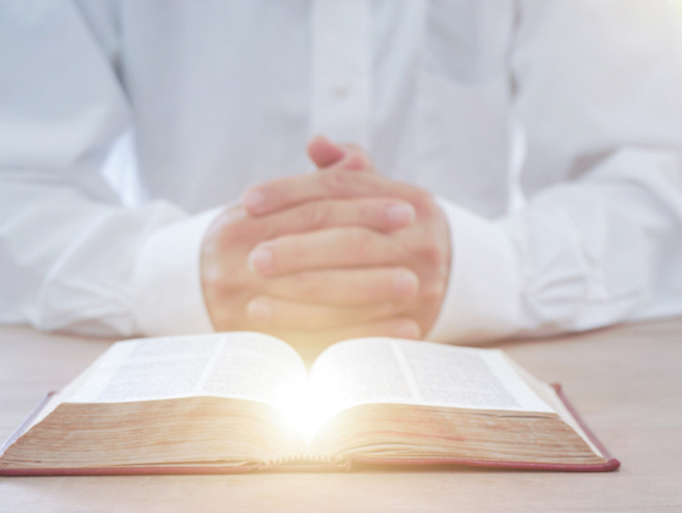 A man reading the Holy Bible