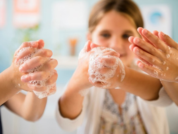 Students washing their hands
