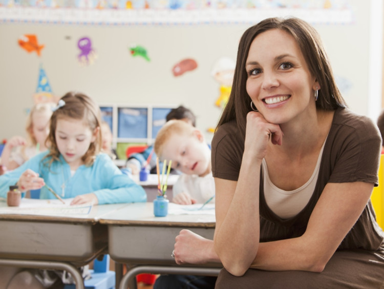 teacher with students doing a painting activity