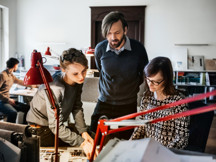 graphic designers discussing a project