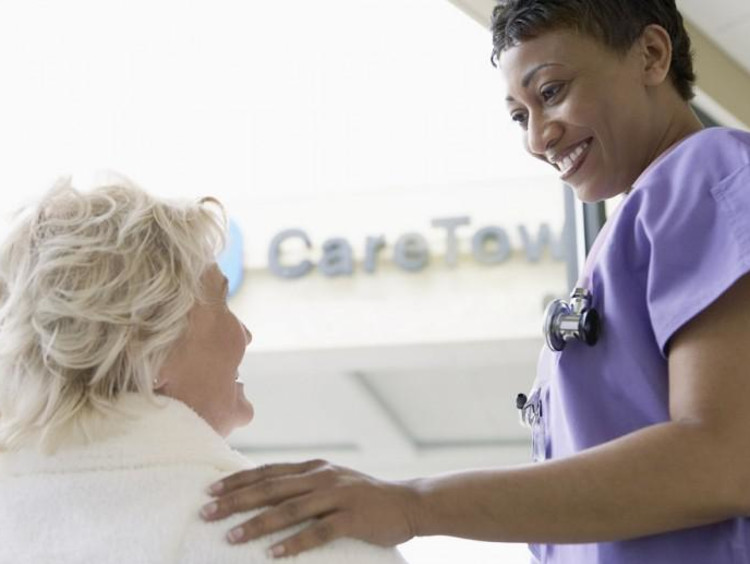 nurse helping patient
