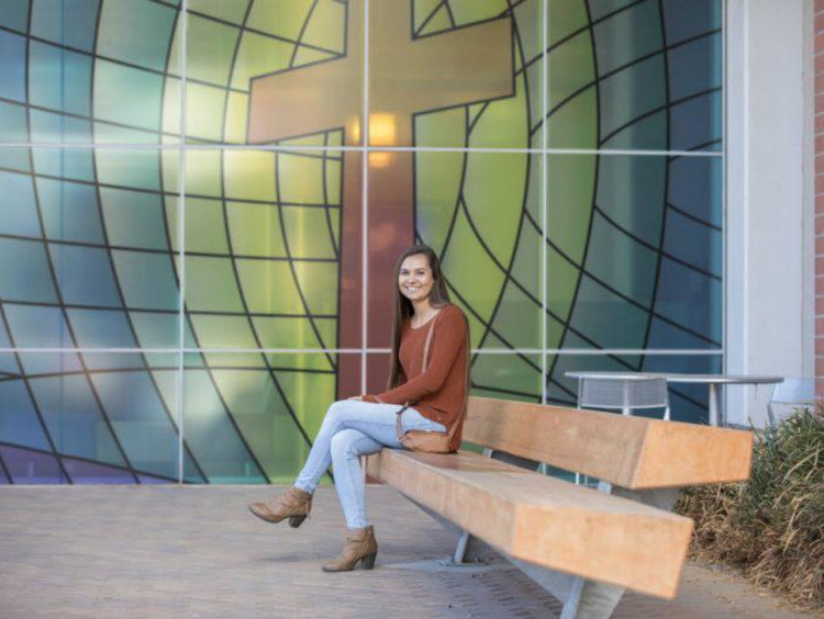 Tatum on campus by the College of Theology