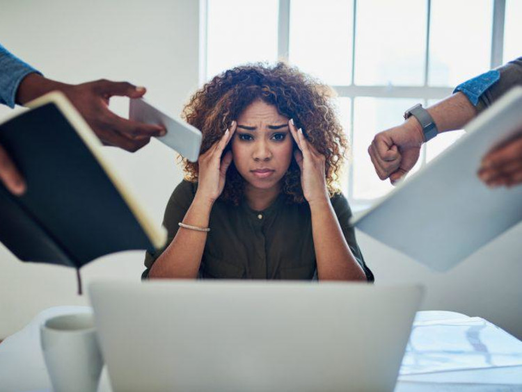 person putting hands on head stressed out
