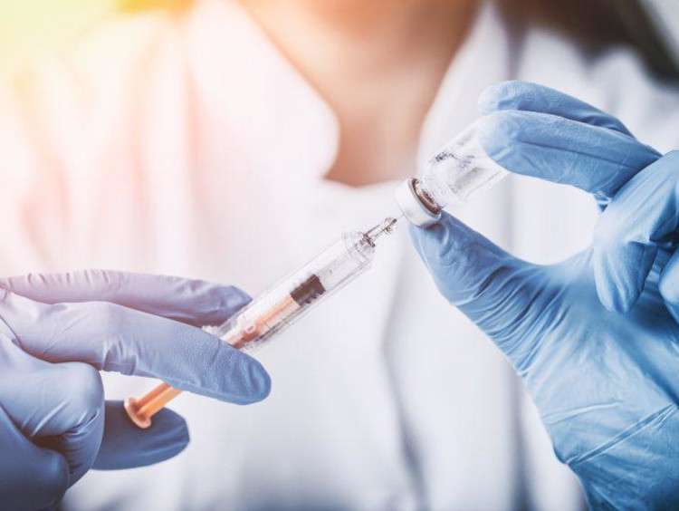 Woman nurse with syringe