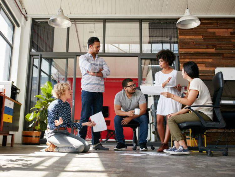 Team has a meeting in a modern workspace