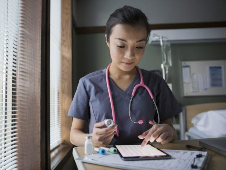 Nurse working on a tablet