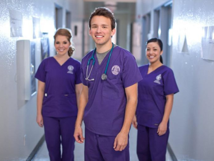 three gcu nursing students in a hallway
