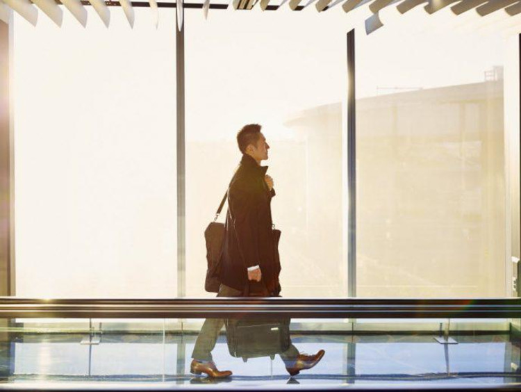 Businessman walks in airport terminal
