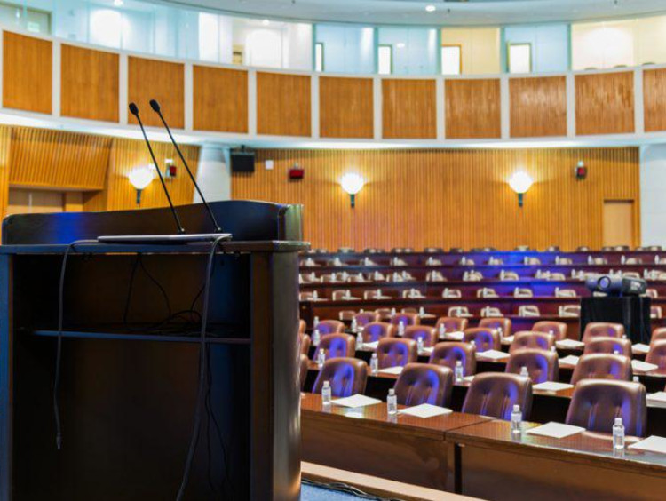 A podium in an empty auditorium